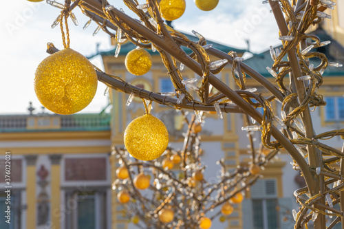 yellow glass balls on a metal tree