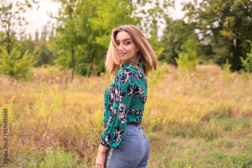 young woman in a field young woman in a field