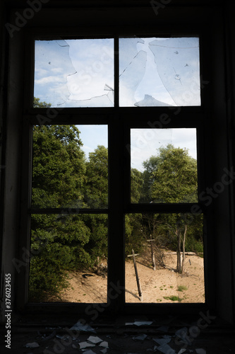 View through broken window in soviet abandoned building at fort Rif  Kronstadt  Saint-Petersburg  Russia