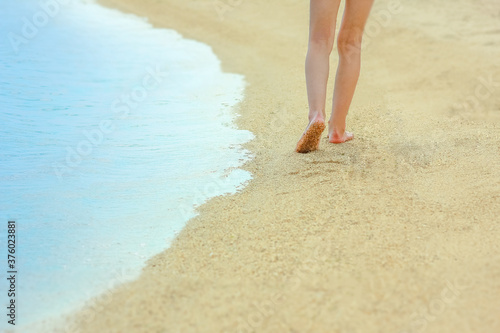 Fototapeta Naklejka Na Ścianę i Meble -  beautiful footprints in the sand by the sea background