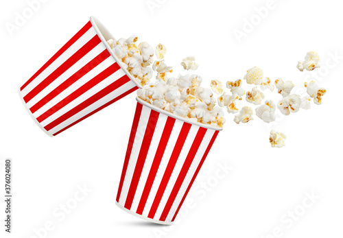 Two red striped paper cups with delicious popcorn, isolated on white background