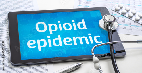 Photos The word Opioid epidemic on the display of a tablet