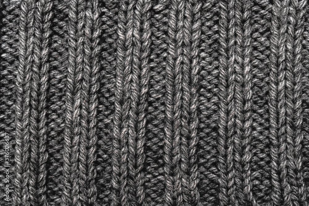 Warm knitted abstract gray  background.