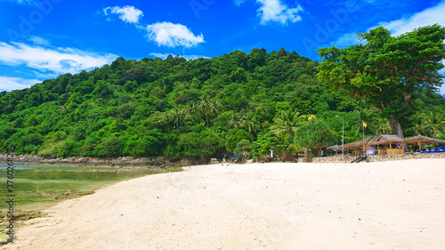 Beautiful Merlin Beach located near Patong in Phuket Island Thailand. View on the jungle, sea, azure water and golden sand.