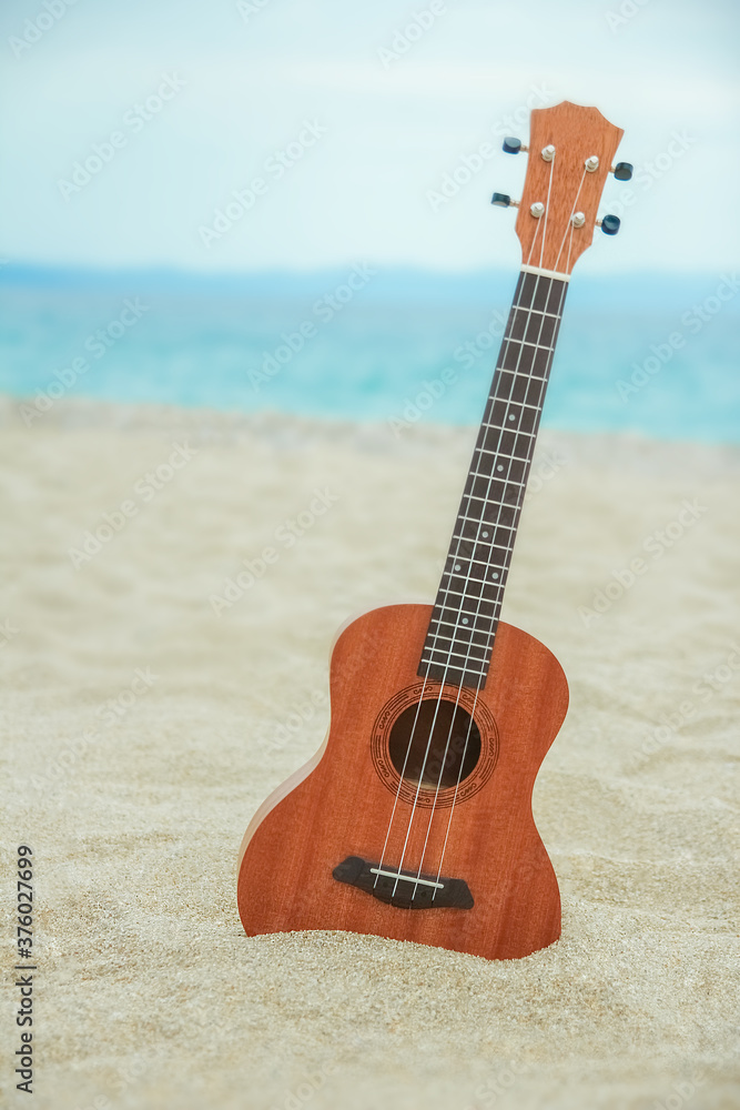 Fototapeta beautiful guitar on the sand by the Greek sea