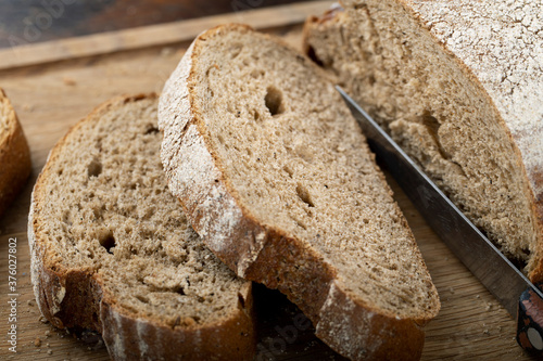 Sliced fresh bread on table close-up.