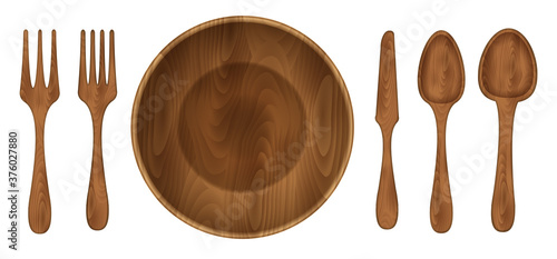 Wooden utensils. Top view. Wooden bowl, spoon, fork, knife. View from above.