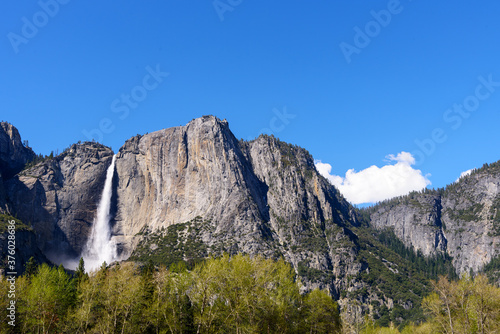 Panoramic view of Upper Yosemite Falls at its peak flow with blue sky, Yosemite National Park