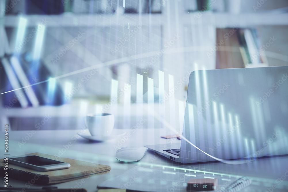 Stock market graph on background with desk and personal computer. Double exposure. Concept of financial analysis. Stock market graph on background with desk and personal computer. Double exposure. Concept of financial analysis.