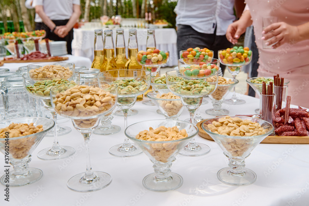 Buffet table with beer snacks at luxury wedding reception outdoors, copy space. Serving food and appetizers at restaurant. Catering banquet table Buffet table with beer snacks at luxury wedding reception outdoors, copy space. Serving food and appetizers at restaurant. Catering banquet table