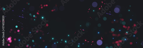 blurred colorful particles from neon lights in front of black backgound