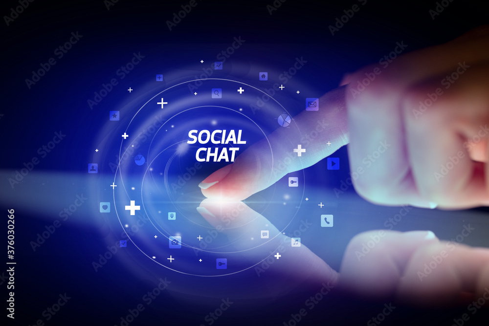 Finger touching tablet with social media icons and SOCIAL CHAT Finger touching tablet with social media icons and SOCIAL CHAT