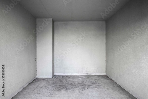 Perspective of Empty dark basement concrete room.
