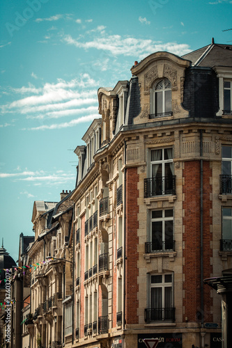 View of the facade of a historical building located in Reims, a city in the Grand Est region of France and one of the oldest in Europe

