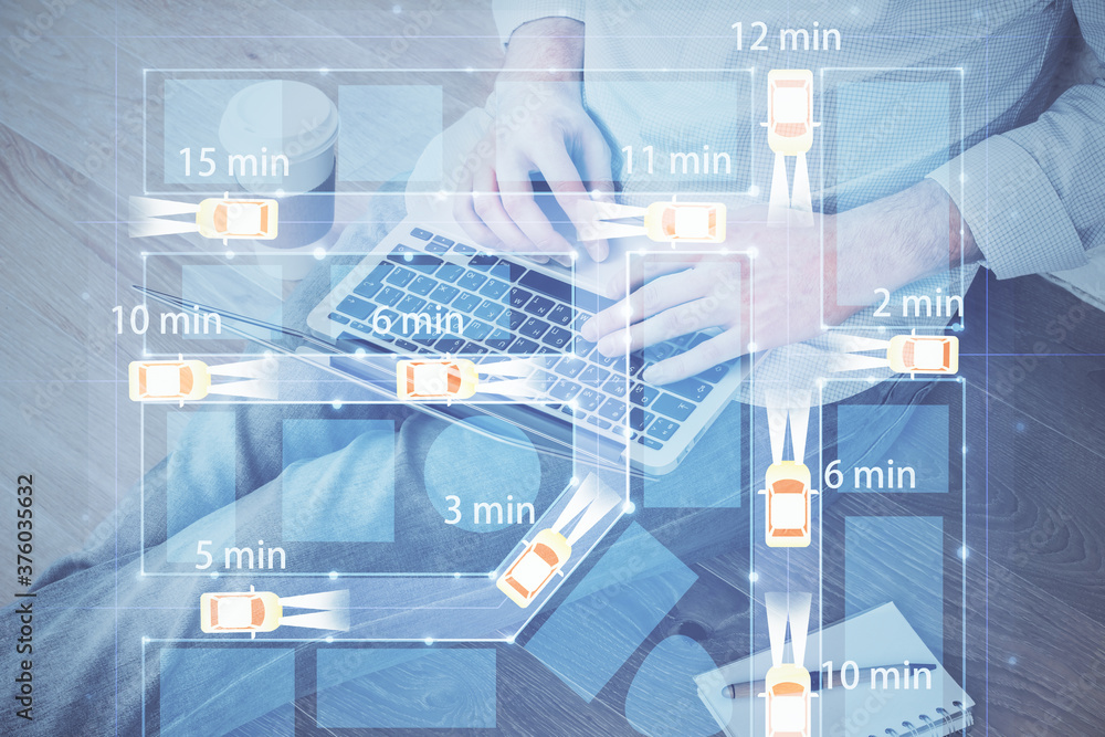 Automobile theme drawing with businessman working on computer on background. Autopilot taxi concept. Double exposure. Automobile theme drawing with businessman working on computer on background. Autopilot taxi concept. Double exposure.