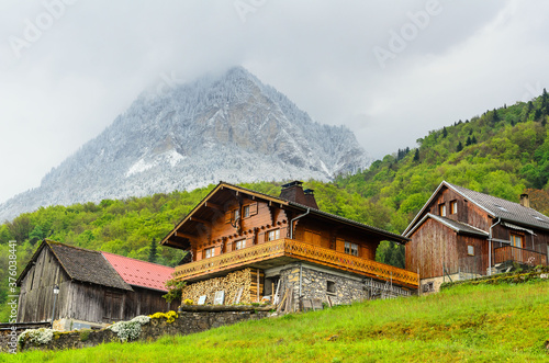 Mountain village in the French alps at the foot of the snow-capped mountains framing the Geneva lake
