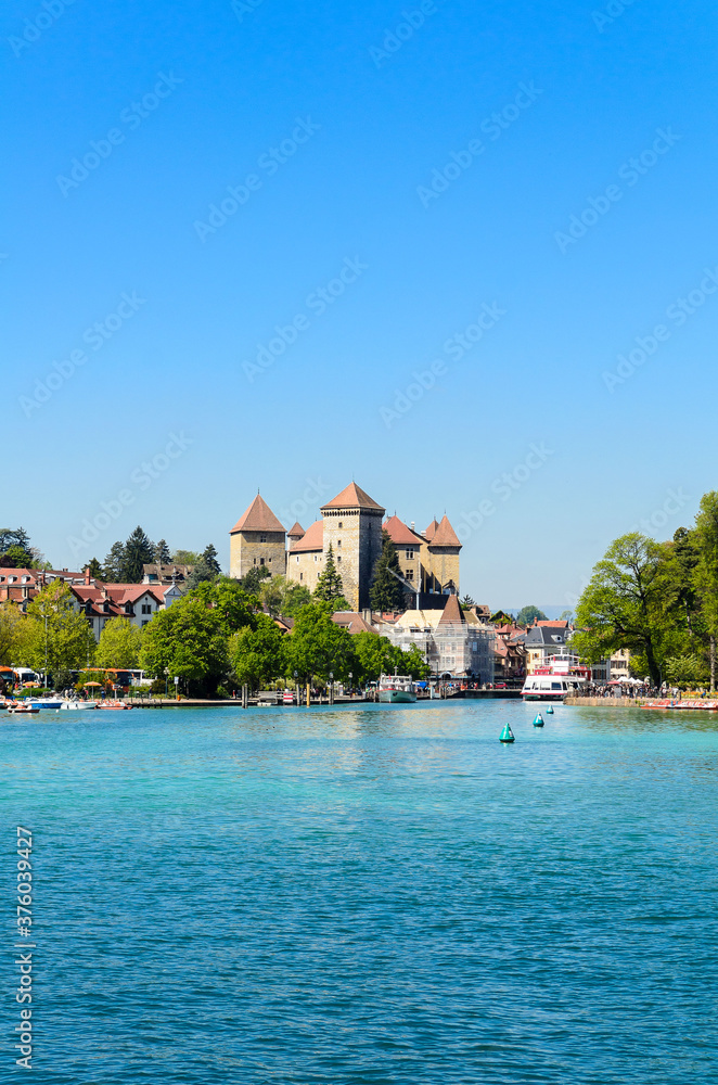 Lake Annecy, a view of the Duingt Castle (Château de Duingt) and the surrounding French Alps. France