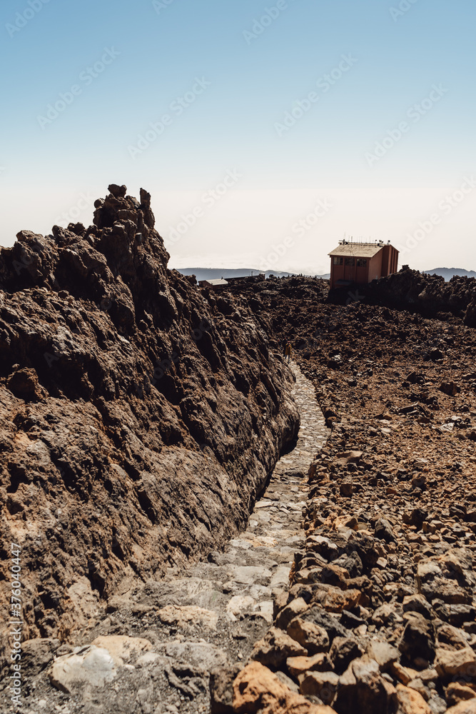 Fototapeta premium Teide National Park. Beautiful view of volcano. Desert area of a volcanic crater with rocks and mountains. Mount in Tenerife. Canary Islands
