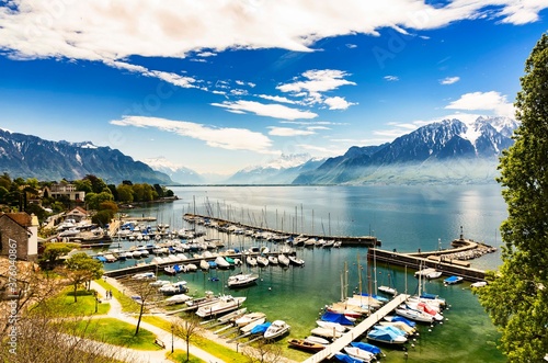 Marina in La Tour-de-Peilz, the Geneva Lake and the surrounding alps. Switzerland.