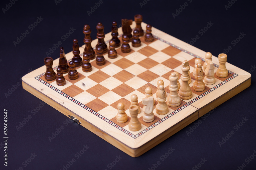 A game of chess, the beginning of a chess game two sides opposite each other. A game of chess, the beginning of a chess game two sides opposite each other.