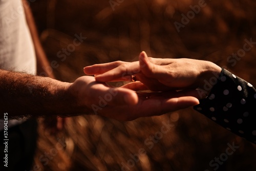 A man holding a woman's hand