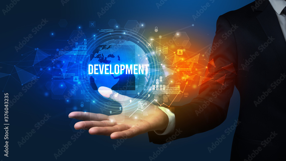 Elegant hand holding DEVELOPMENT inscription, digital technology concept Elegant hand holding DEVELOPMENT inscription, digital technology concept