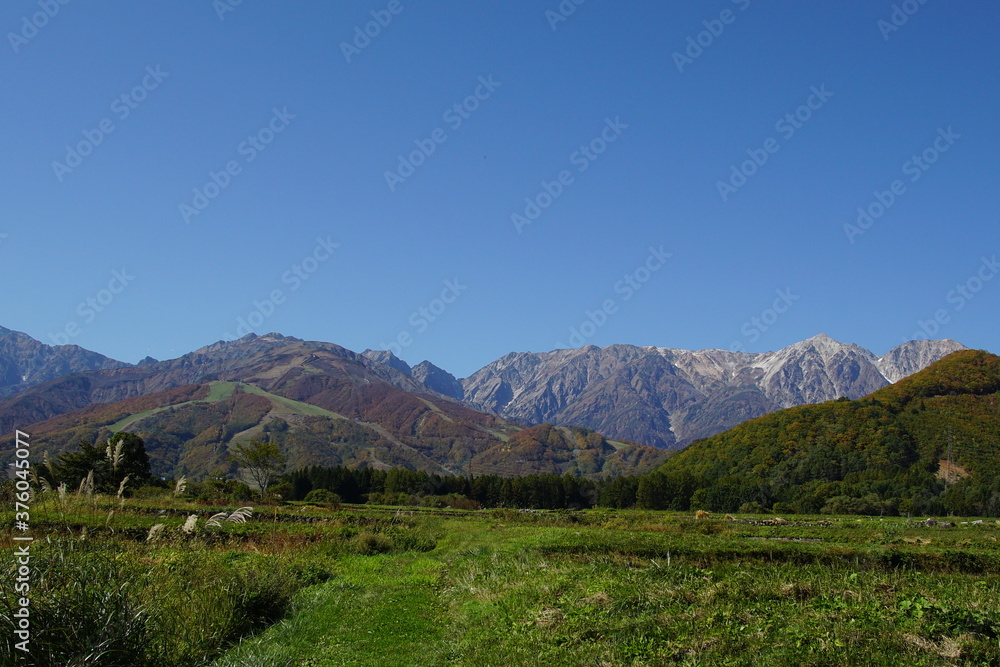 sunny autumn panorama of countryside in Japan, Hakuba valley