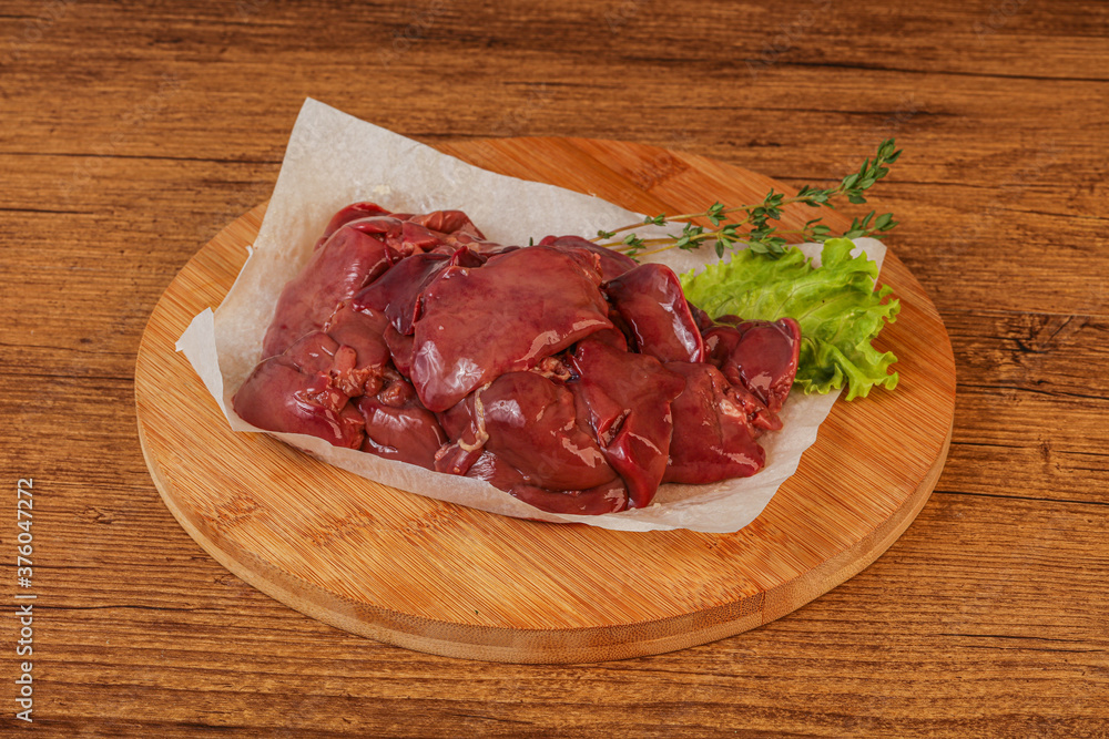 Raw chicken liver over board