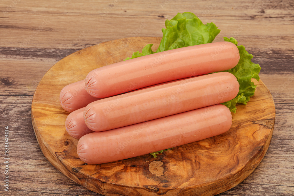 Tasty meat sausages over board Tasty meat sausages over board
