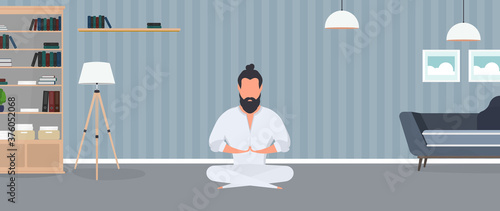 A man in a white kimono meditates. Kung Fu Master. The guy is doing yoga. Vector.