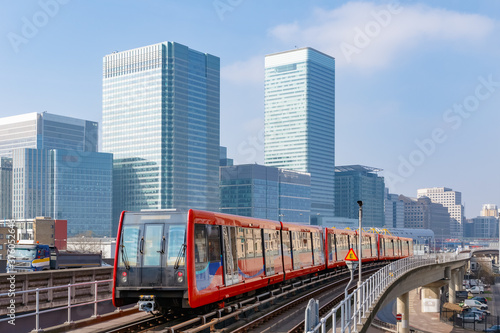 Canvas Print Docklands light railway in London with Canary Wharf in the background