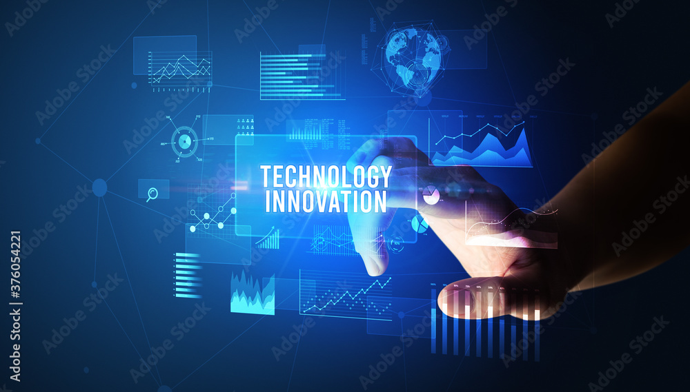Hand touching TECHNOLOGY INNOVATION inscription, new business technology concept Hand touching TECHNOLOGY INNOVATION inscription, new business technology concept
