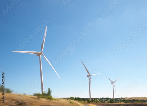 Wind turbine landscape in a field on a sunny summer day