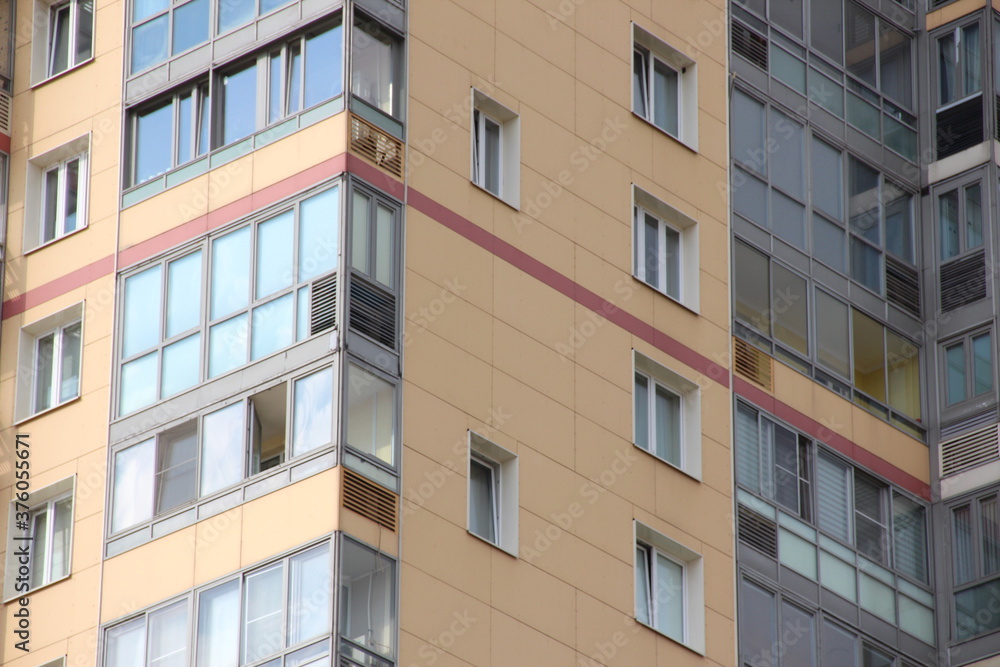 Windows of a multi-storey residential building close-up