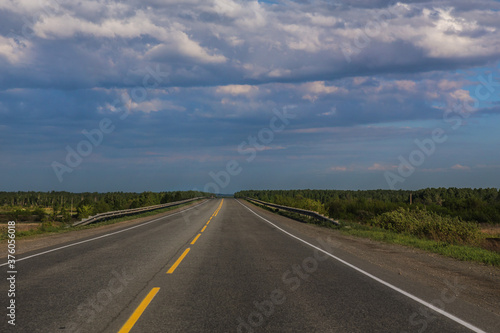 Empty highway crossing the horizon