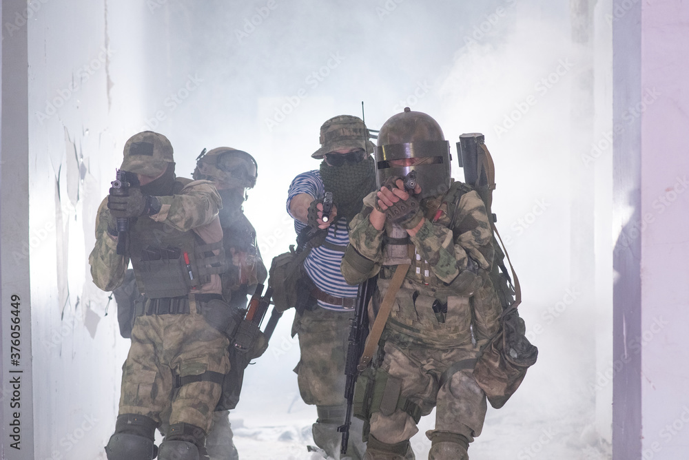 Airsoft team make a takeover of a building in smoke Airsoft team make a takeover of a building in smoke