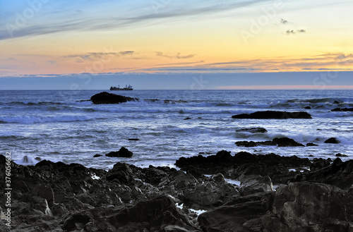 ship near the coast of the ocean in the evening