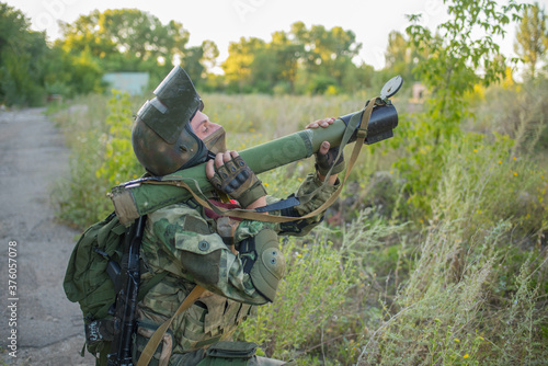 Airsoft grenade launcher aiming at an object that needs to be destroyed