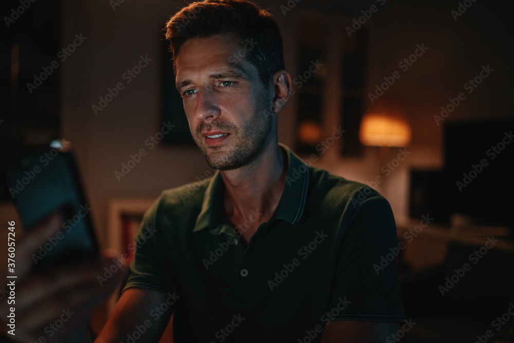 Young businessman having online meeting call late at night communicates with colleagues discussing new project strategy, Professional manager freelancer using smartphone device making online search Young businessman having online meeting call late at night communicates with colleagues discussing new project strategy, Professional manager freelancer using smartphone device making online search