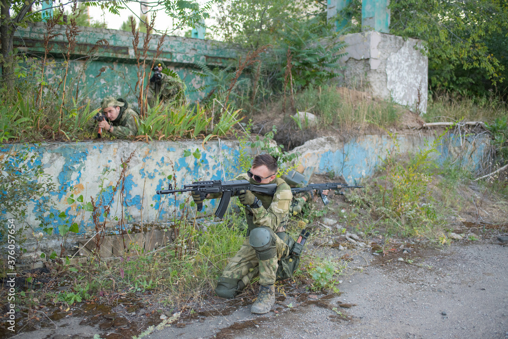 A team of airsoft players prepared for the attack of opponents