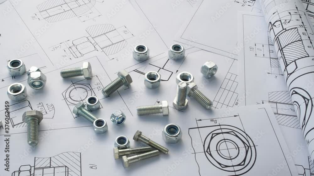 Bolts and nuts on paper engineering drawings. Bolts and nuts on paper engineering drawings.