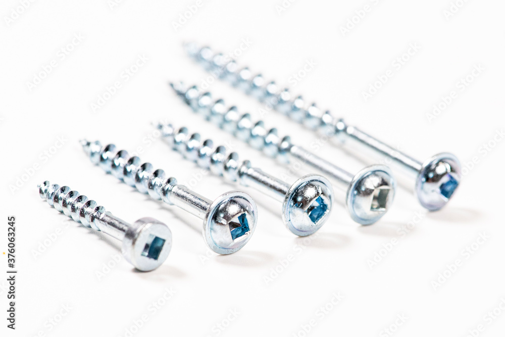 Screw on white background. Macro carpentry tool Screw on white background. Macro carpentry tool