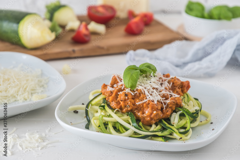 Zoodles bolognese: zucchini noodles with meat or vegan soy meat sauce and parmesan. For low carb, keto, paleo nutrition. Zoodles bolognese: zucchini noodles with meat or vegan soy meat sauce and parmesan. For low carb, keto, paleo nutrition.