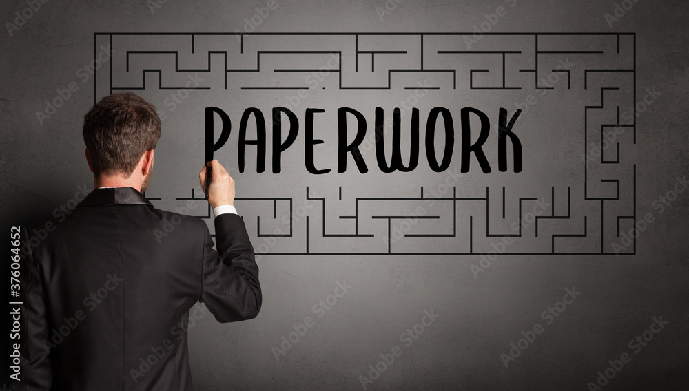 businessman drawing maze with PAPERWORK inscription, business education concept businessman drawing maze with PAPERWORK inscription, business education concept