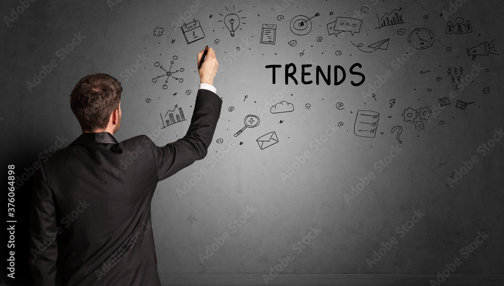 businessman drawing a creative idea sketch with TRENDS inscription, business strategy concept businessman drawing a creative idea sketch with TRENDS inscription, business strategy concept