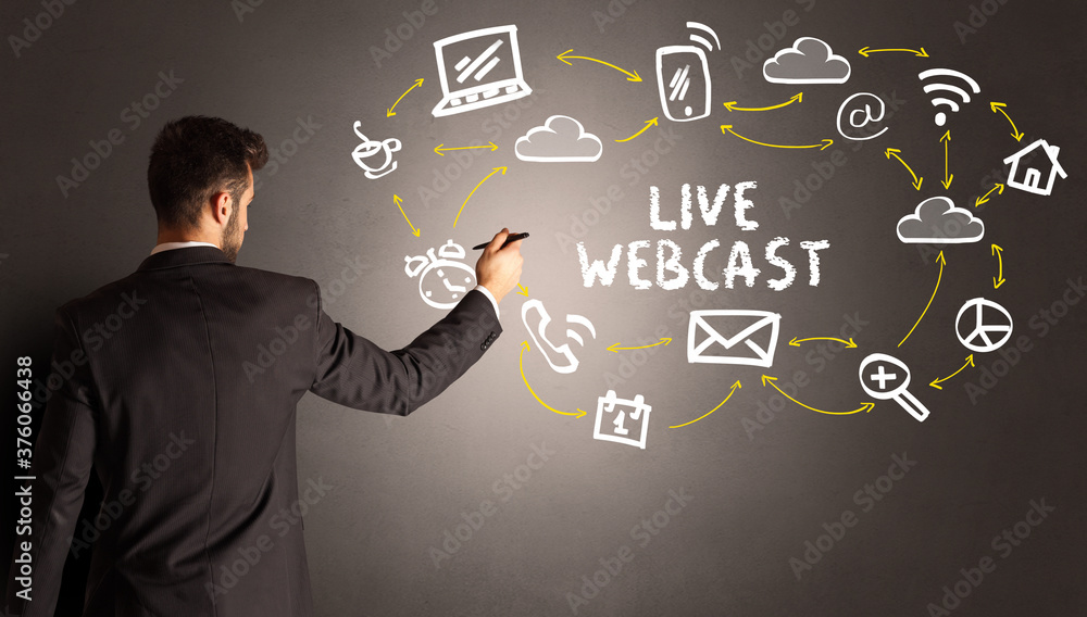 businessman drawing social media icons with LIVE WEBCAST inscription, new media concept businessman drawing social media icons with LIVE WEBCAST inscription, new media concept