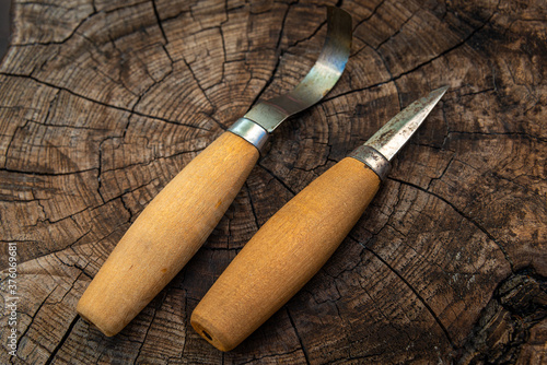 Swedish style wood carving  and spoon or hook knife  on wood background , for wood carving and spoon making , hobby or pastime.