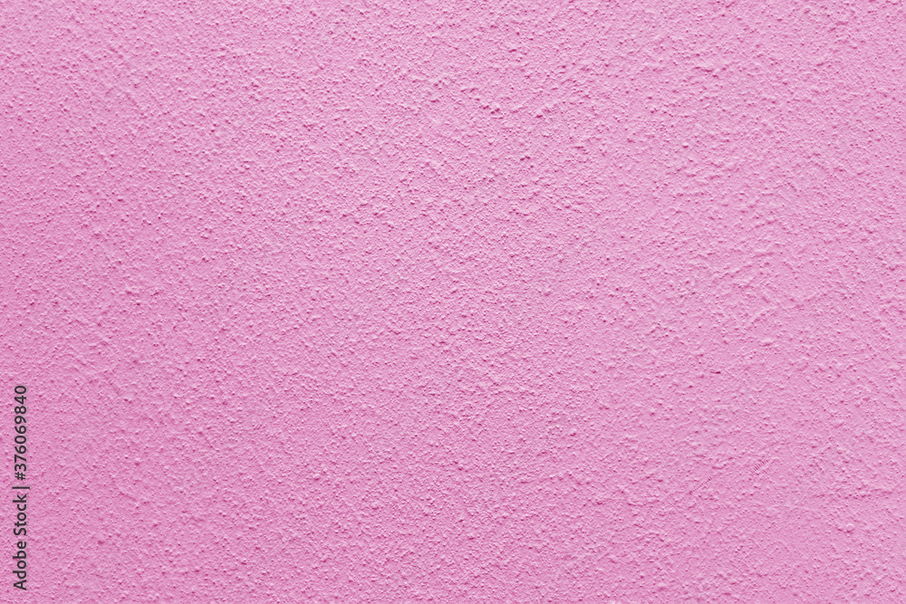 Pink wall of the building. Rough plaster surface. Abstract background. Pink wall of the building. Rough plaster surface. Abstract background.