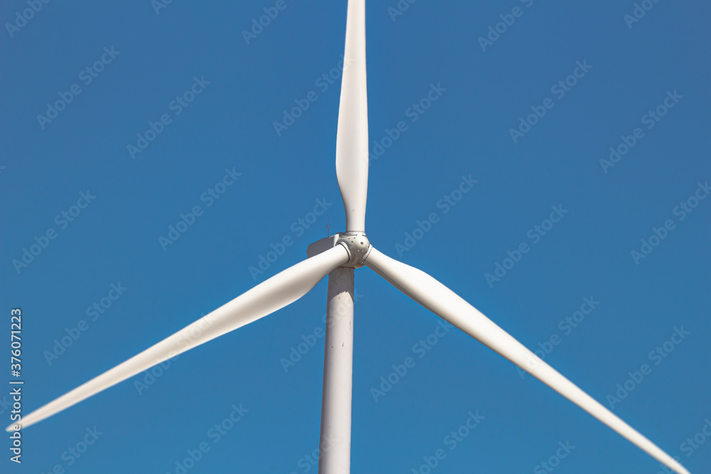 Close up, front view of a wind tower turbine electricity gererator, renewable energy source. Close up, front view of a wind tower turbine electricity gererator, renewable energy source.