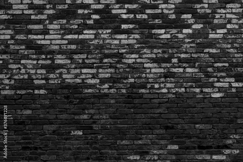 Black brick building wall. Interior of a modern loft. Background for design